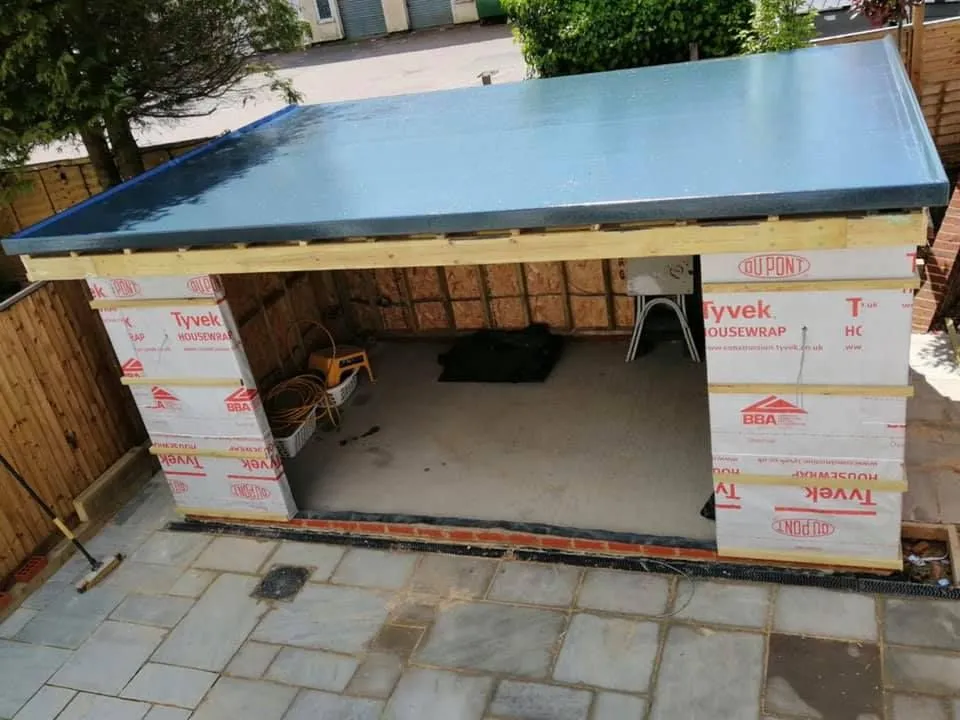 garage-roof-replacement-derby-flat-roof-contractor A Derby flat roof contractor working on a garage roof replacement