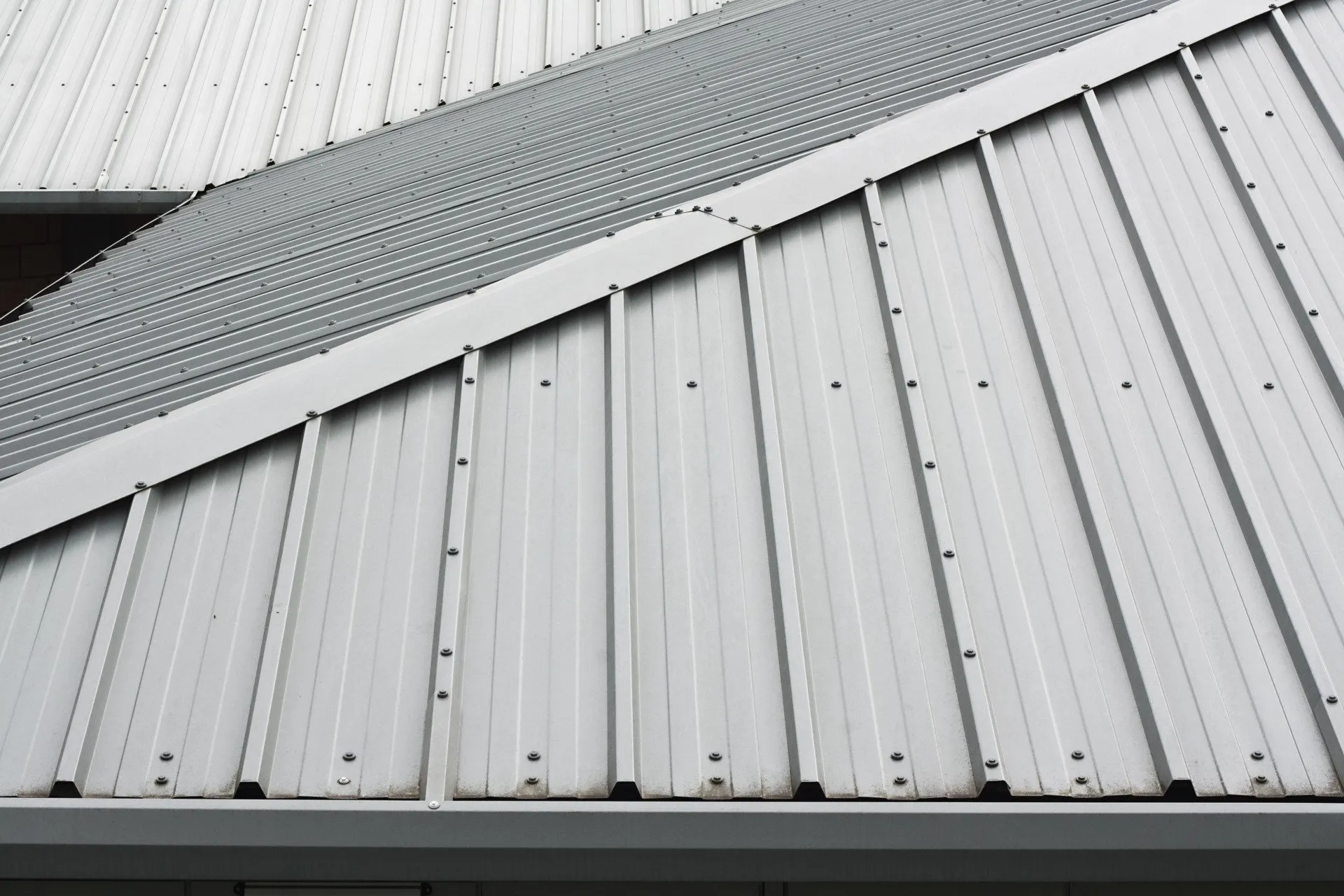 A standing seam metal roof installed on a Derby property