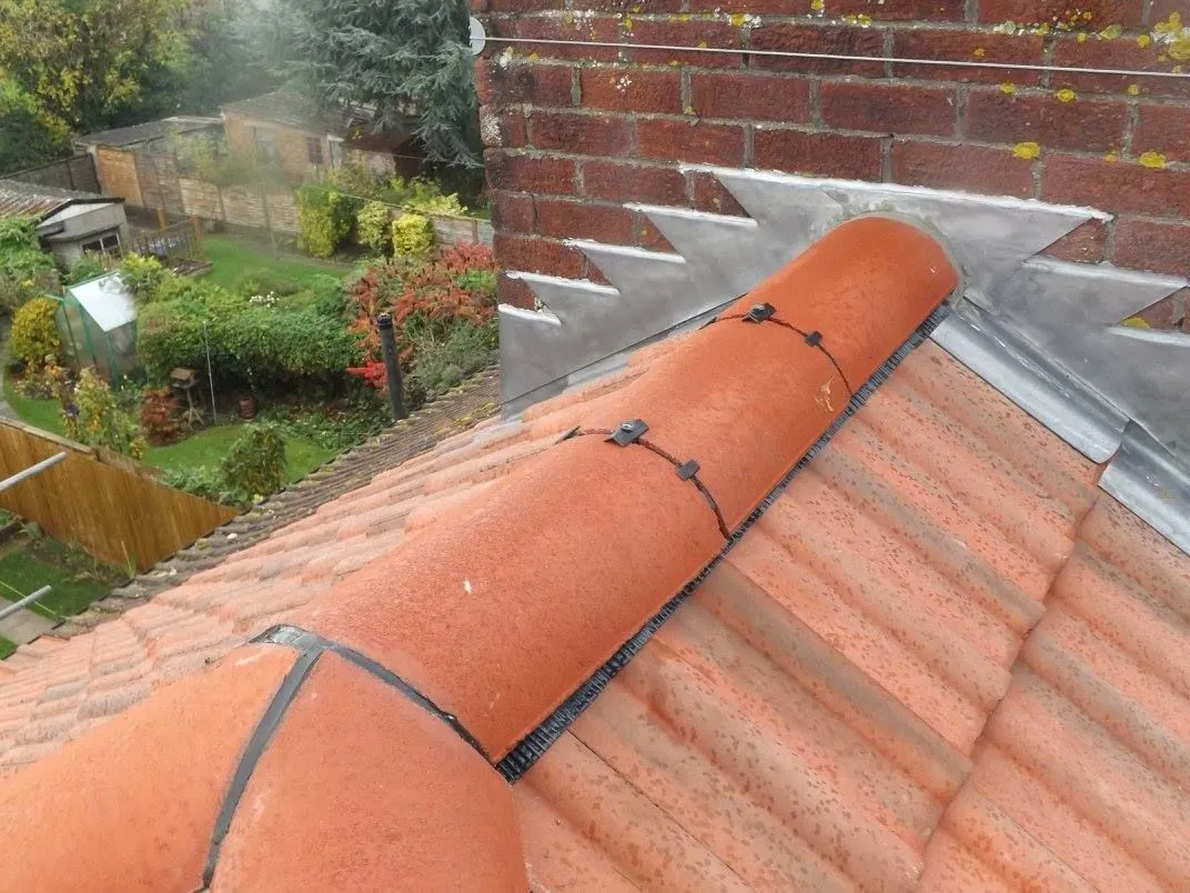 Ridge tile repairs and rebedding in Derby